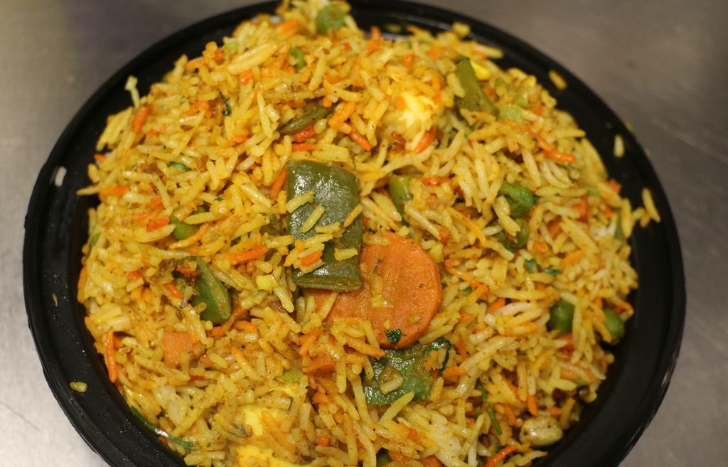Veg Biryani · Basmati rice cooked with mixed veg, paneer and spices.