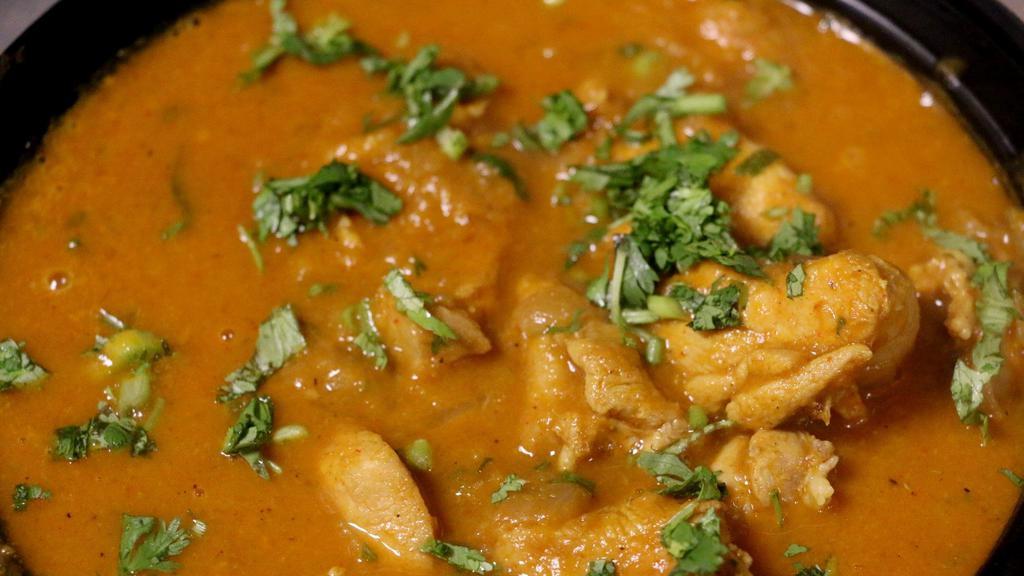 Chicken Curry (Non Veg) · Boneless chicken in masala curry.
