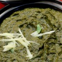 Palak Paneer (Veg) · Paneer cooked with spinach and spices.