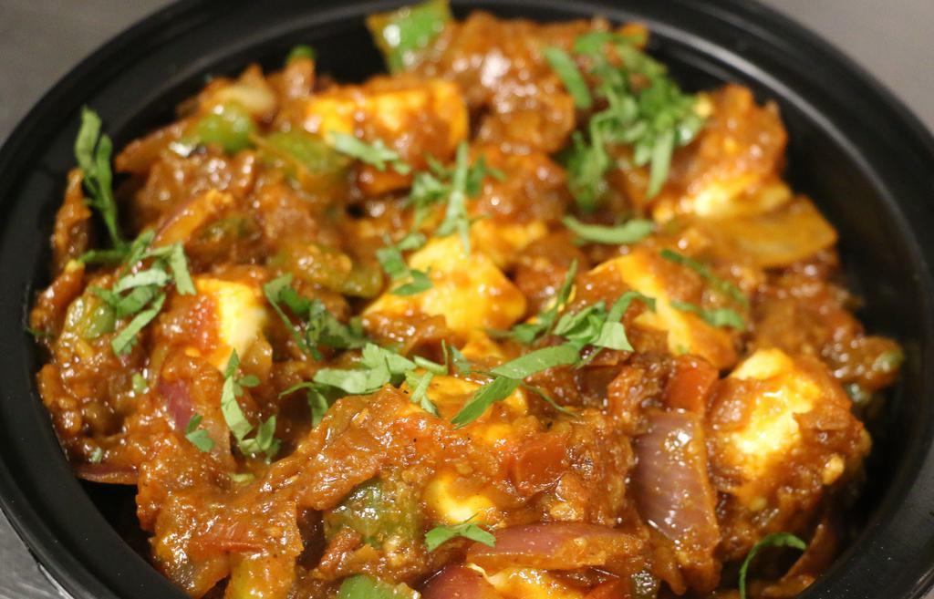 Kadhai Paneer (Veg) · Paneer onion and green peppers combo in masala gravy.