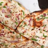 Onion Kulcha · Flat bread stuffed with onions and spices.