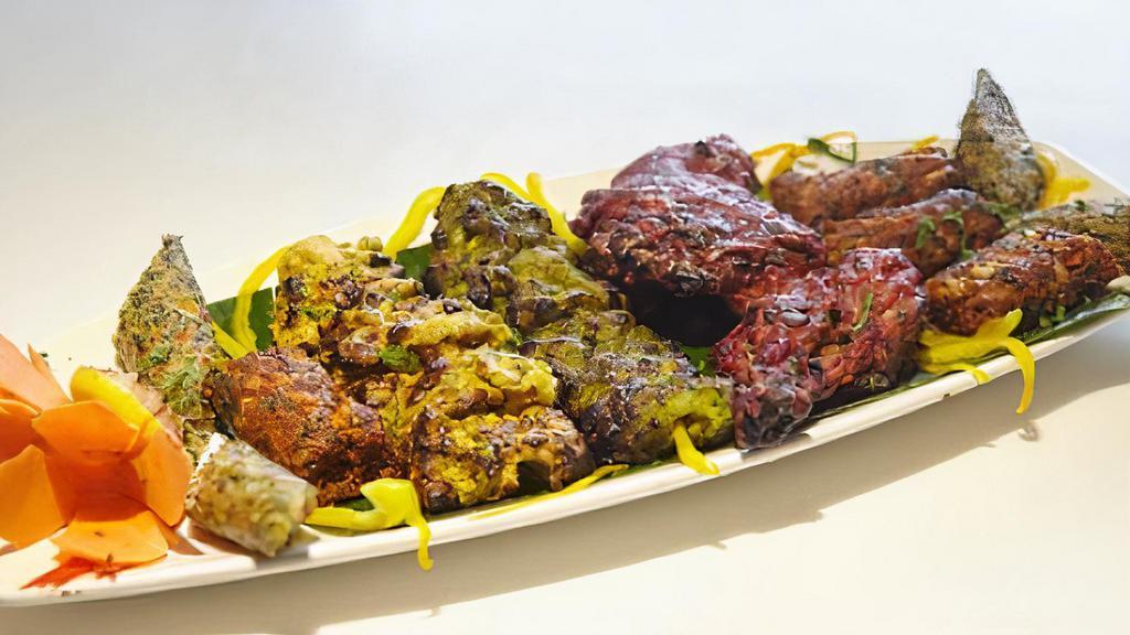 Mix Non-Veg Grill · Mix Grill with tandoori chicken,chicken tikka, Chicken Malai Tikka, Chicken Achari Tikka and Chicken Seekh Kabab