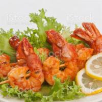 Shrimp Tikka  · Shrimp marinated with yogurt,herbd and spices and grilled in a clay oven.