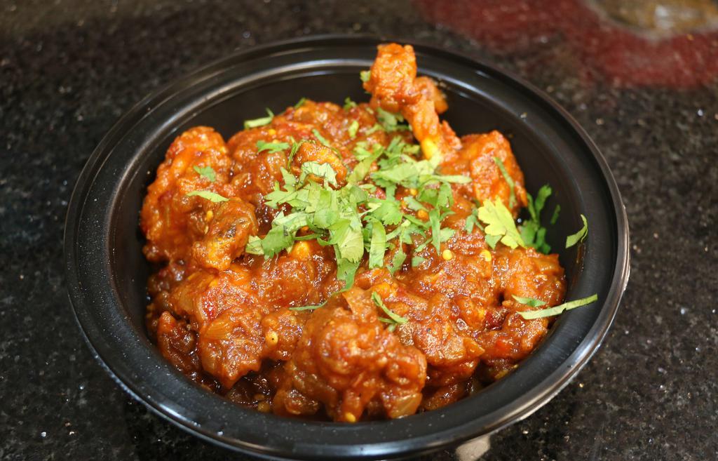 Lollipop Chicken · Frenched chicken winglet cooked in garlic chilli thick masala sauce.