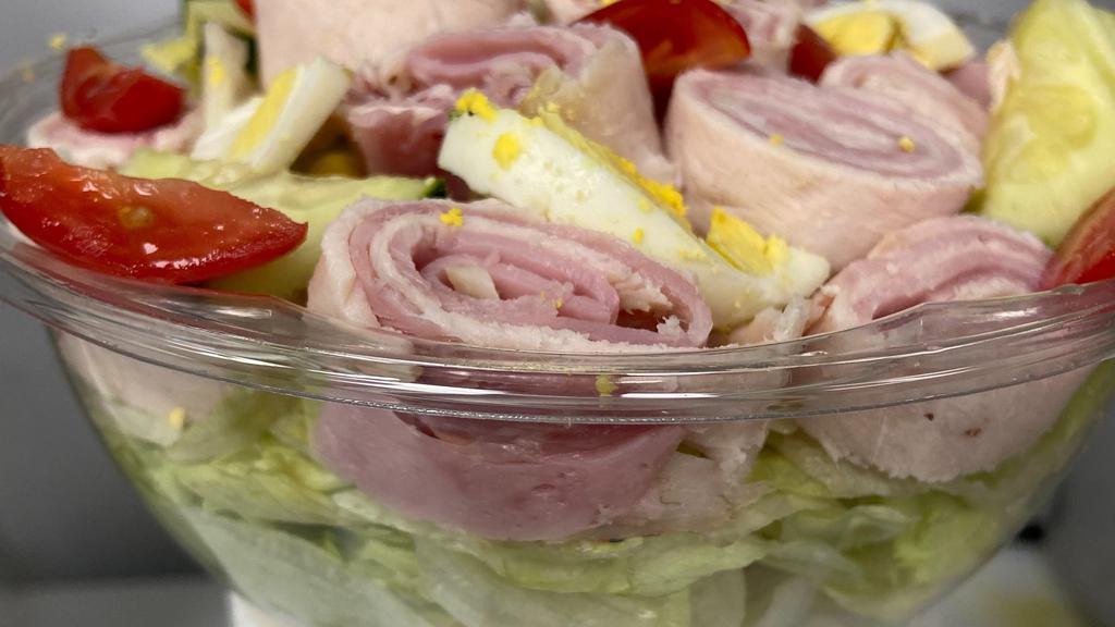 Chef Salad · Iceberg lettuce, boar’s head® branded deluxe ham, boar’s head® ovengold turkey, boiled egg, cucumber and cherry tomatoes.