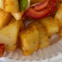 Home Fries · A side of home fries made fresh daily.  Idaho potatoes slow cooked with onions peppers with ...