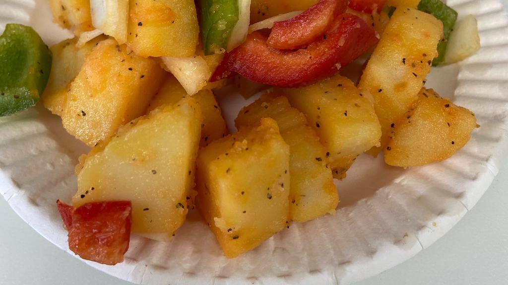 Home Fries · A side of home fries made fresh daily.  Idaho potatoes slow cooked with onions peppers with a delightful blend of seasoning.