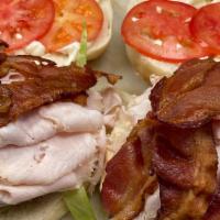 Turkey Club Specialty Sandwich · Boar’s head® ovengold turkey with crispy bacon, lettuce, tomatoes, and boar’s head® real may...