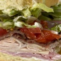 American Combo Specialty Sandwich · Boar’s head® branded deluxe ham, ovengold® turkey, roast beef, American and mild swiss, lett...