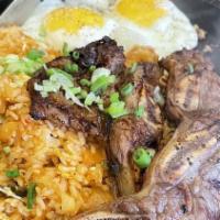 Boka Steak & Eggs · BBQ short ribs over kimchi fried rice and TWo eggs sunny-side up.