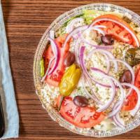 Greek Salad · Lettuce, tomato, cucumber, red onion, feta cheese, greek olives, peperoncini, dolmades*, hom...