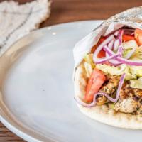 Chicken Souvlaki · Cubes of marinated white meat chicken on pita topped with lettuce, tomato, and onion.
Tzatzi...