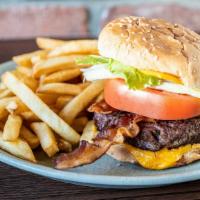 Beef Burger Deluxe · Includes lettuce, tomato, cheese and choice of one topping and one sides.