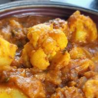 Aloo Gobi · Spiced potatoes, cauliflower, tomatoes, cooked with ginger and cumin seeds.