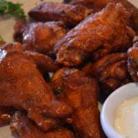 Buffalo Wings · Buffalo wings 12 jumbo chicken wings tossed in either spicy buffalo or barbeque or sweet chi...