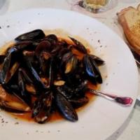 Zuppa Di Mussels · Fresh mussels simmered in a red or white wine sauce.