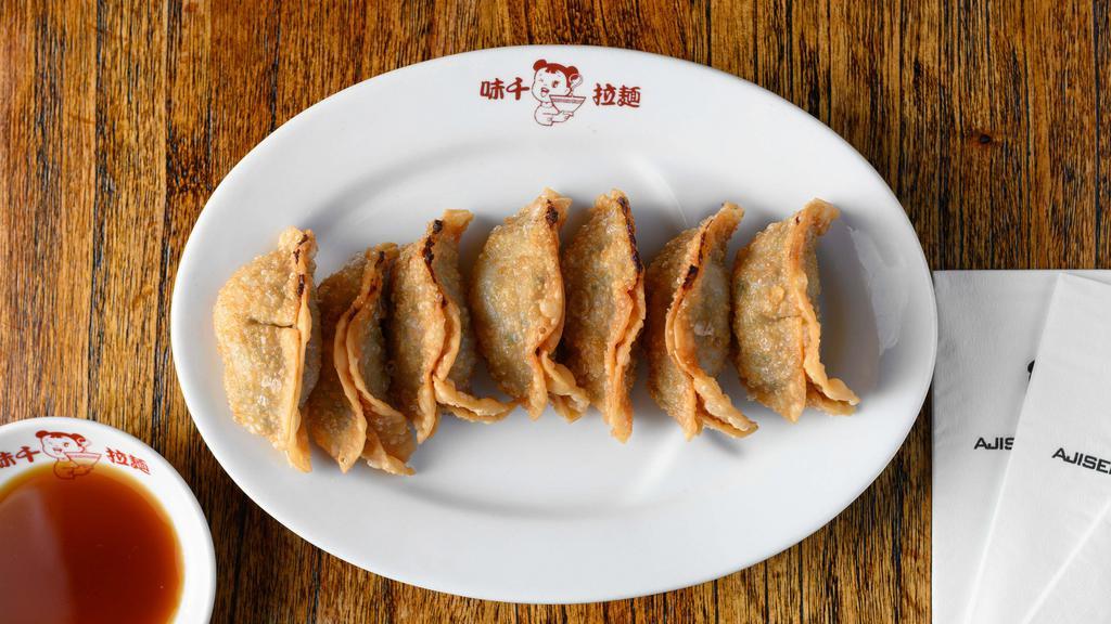 Gyoza · Pan fried dumplings filled with pork and vegetables.