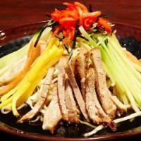Hiyashi Chuka · Cold ramen topped with chashu, crabsticks, cucumber, pickled ginger, scallion, sesame, wakam...