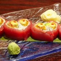 Tuna Lover Roll · Inside: spicy tuna, crunch, avocado; outside: tuna, honey wasabi sauce.