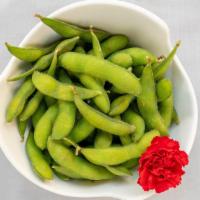 Edamame · The pods are boiled served with salt .