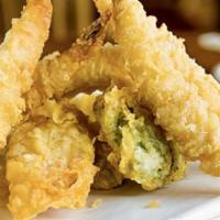 Vegetable Tempura · Seven pieces of vegetable tempura, with tempura sauce on the side.
