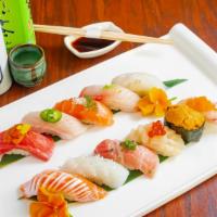 Sushi Deluxe   · Chef choice of 12 pieces sushi with one California roll or Tuna Roll, or Salmon Roll. Served...