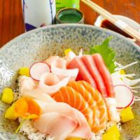 Chirashi · 12 Pieces of raw fish over seasoned rice. Served with soup and salad.