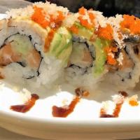 Chicago Roll · Salmon and cucumber topped with eel and avocado, tobiko, eel sauce and tempura flakes.