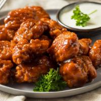 Honey Mustard Boneless Wings · Crispy breaded boneless wings tossed in honey mustard with your choice of dipping sauce.