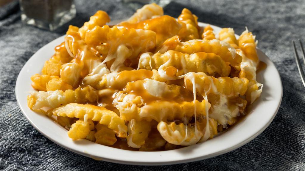 Disco Fries · French fries topped with gravy and cheese.