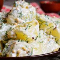 Potato Salad · Boiled potatoes prepared with celery, onion, mustard, pepper and mayonnaise.
