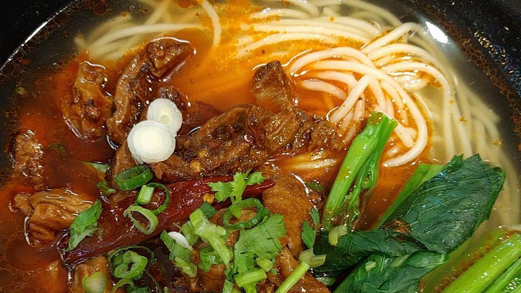 Hot & Spicy Intestine Noodle · Pork Intestines, Chinese Cabbage, Cilantro, and Green Onion.