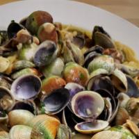 Linguini Vongole · Pasta with baby clams and fresh tomatoes.