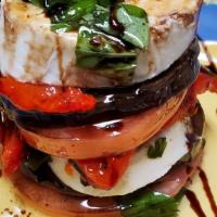 Antipasto Dell'Orto · Layered mozzarella, eggplant, tomato, and roasted pepper.