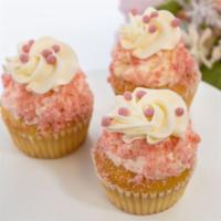 Strawberry Shortcake Cupcake · Vanilla cupcake filled with strawberry buttercream, topped with vanilla buttercream, and str...