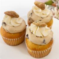 Cookie Dough Cupcake · Yellowcake filled and topped with cookie dough buttercream, and a mini chocolate chip cookie.