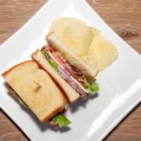 Roast Beef Sandwich · Beef, onion, cheese, tomato, lettuce, mayo.