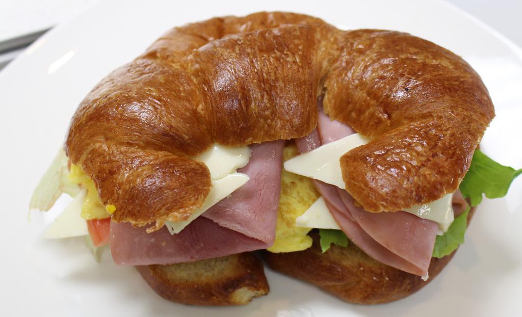 Croissant Sandwich · Ham, scrambled egg, cheese, tomato and lettuce.