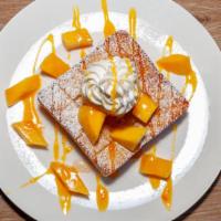 Mango Honey Toast · Vanilla ice cream, fresh mango with whipped cream and mango syrup.
