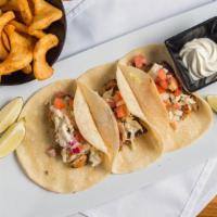 Blackened Mahi Mahi Tacos · Served with pico de gallo and coleslaw with a side of sour cream and lime; served on soft co...