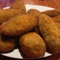 Jalapeño Poppers · Breaded & deep-fried cheese-filled jalapeño poppers. Served with a side of ranch.