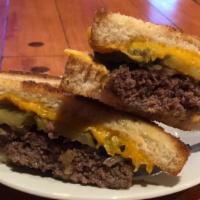 Toli'S Grilled Cheese Burger · Fresh ground beef burger, grilled onions & pickles. Layered with American and Cheddar cheese...