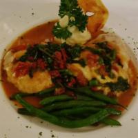 Lucchese Chicken/Pollo Lucchese · Chicken breast with broccoli rabe, sun-dried tomato and melted mozzarella.