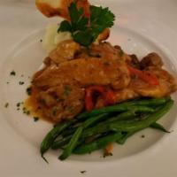 Paesana Chicken/Pollo Alla Paesana · Chicken with sweet Italian sausages and peppers.