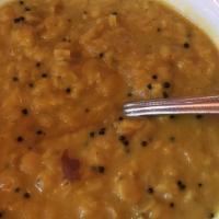 Dhal Curry · Slow-cooked lentils with Sri Lankan spices in a coconut milk curry. Made with a special hous...