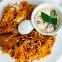 Chicken Biriyani · Aromatic combination of saffron, cashew nuts, raisins and herb-flavored rice. Served with a ...