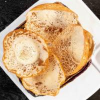 Aappa · Wafer-thin, bowl-shaped pancakes made from a fermented batter or rice flour and coconut milk...