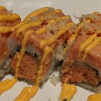 Paradise · Spicy tuna inside, topped with spicy tuna, finished with spicy mayo and tempura flakes.