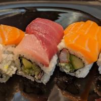 Rainbow · California roll inside and topped with assorted fish.