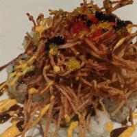 Volcano · spicy tuna belly, avocado, tempura flakes finished with fried crab stick, eel sauce, spicy m...